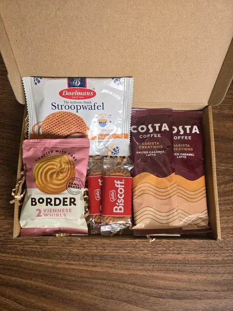Open Costa Coffee and Treats box showing the packaged contents